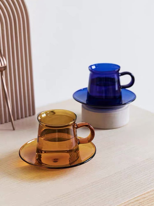 ARCHIVE's translucent jewel blue coloured fancy glass that comes with a saucer to serve any drinks or dessert you like to your guests! This piece of artisanal kitchenware makes your home a little more modern and unique