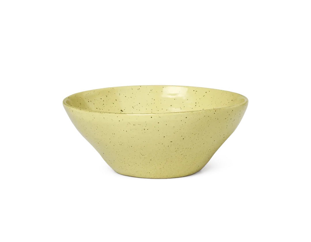 Discover the beauty of the FermLiving Flow Bowl from ARCHIVE, a stunning artisanal kitchenware piece in a captivating yellowish greenish hue.