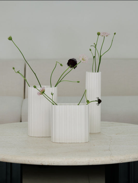 At ARCHIVE, we create a captivating centerpiece with the Openobject Artisanal Kitchenware Geometric Low Vase.
